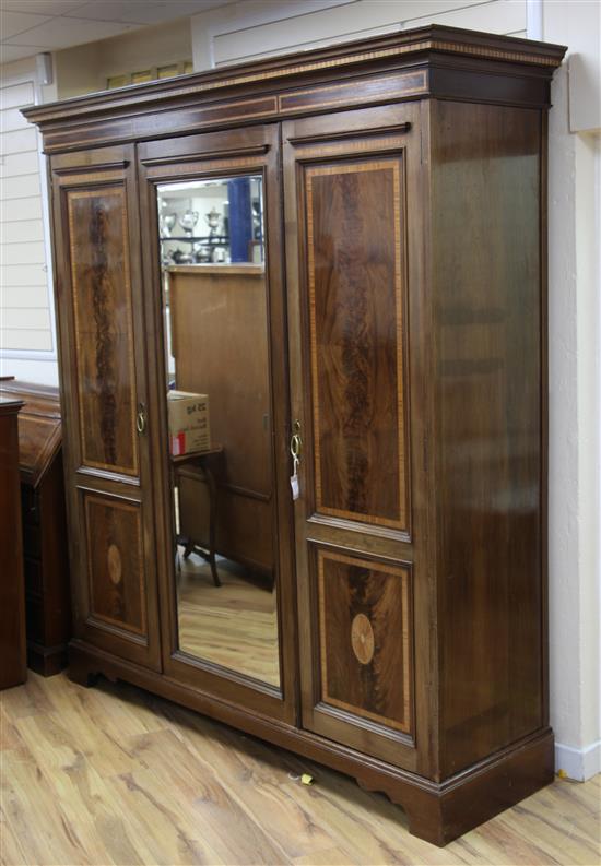 An Edwardian mahogany satinwood crossbanded triple wardrobe, W.6ft 3.5in.